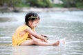 Two cute asian little child girls sitting and playing with sand Royalty Free Stock Photo