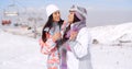 Two cute attractive young women at a ski resort Royalty Free Stock Photo