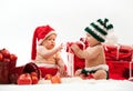 Two cute babies in Christmas costumes Royalty Free Stock Photo