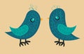 Two cute blue birds with a pattern on the body, a yellow beak and a blue eye