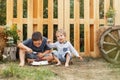 Two cute boys happily eating healthy food outdoors. Adventure time. Royalty Free Stock Photo