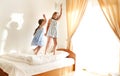 Two cute carefree little sisters girls in casual clothes playing having fun in childrens room Royalty Free Stock Photo