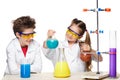 Two cute children at chemistry lesson making