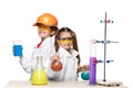 Two cute children at chemistry lesson making