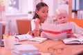 Two cute children reading a chinese book Royalty Free Stock Photo