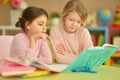 Portrait of little girls doing homework together Royalty Free Stock Photo