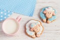 Two cute gingerbread sheep with cup of milk