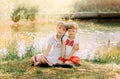 Two girls sisters hug and having fun in the summer in nature. Concept of happy childhood and summer leisure. Kids play outdoor Royalty Free Stock Photo