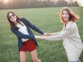 Two girls dancing at sunset Royalty Free Stock Photo