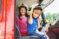 Two cute kids playing in fire truck Royalty Free Stock Photo