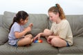 Two cute kids playing with flexible toy the Pop It fidget. Royalty Free Stock Photo