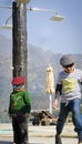 Two stylish kids wearing caps having fun together