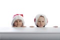 Two cute little boys with xmas hats