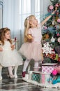 Two cute little girls in a festive New Year`s atmosphere Royalty Free Stock Photo