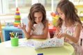 Two cute little girls drawing with pencils Royalty Free Stock Photo