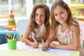 Two cute little girls drawing with pencils Royalty Free Stock Photo