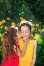 Two Cute little girls embracing and smiling at summer party. Happy kids outdoors. Place for text Royalty Free Stock Photo