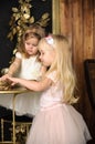 Two cute little girls in a festive New Year`s atmosphere Royalty Free Stock Photo