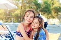 Two Cute Little Girls hugging and smiling at the Seaside at  Summer Sunny Day, Ocean Coast, happy Kids concept Royalty Free Stock Photo