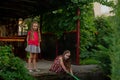 Two cute little girls playing with a city fountain on hot and sunny summer day. Two little girls in the summer Royalty Free Stock Photo