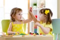 Two cute little girls playing together in daycare