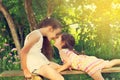 Two cute little girls smiling and playing at the park. Toned. Royalty Free Stock Photo