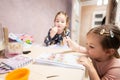 Two cute little sisters painting at home Royalty Free Stock Photo