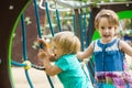 Two cute little sisters at playground Royalty Free Stock Photo