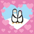 Two cute penguins are holding each other by the paw. Royalty Free Stock Photo