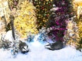 Two cute raccoons are sitting under a tree on new year`s eve. decorations for the shopping center and shop windows. stylish