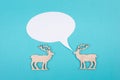Two cute reindeers talking to each other, speech bubble with copy space, christmas greetings