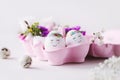 Two cute sleeping Eastereggs in a pink egg box with beautiful flower decoration Royalty Free Stock Photo