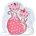 Two Cute Tigers is sitting on a heart