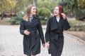 Two cute young girls are walking and talking about important topics. Royalty Free Stock Photo