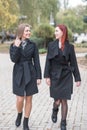 Two cute young girls are walking and talking about important topics. Royalty Free Stock Photo