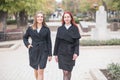 Two cute young girls are walking and talking about important topics. Royalty Free Stock Photo