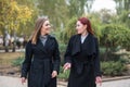 Two cute young girls are walking and talking about important topics. Royalty Free Stock Photo