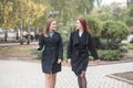 Two cute young girls are walking and talking about important topics. Royalty Free Stock Photo