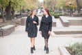 Two cute young girls are walking and talking about important topics. Royalty Free Stock Photo