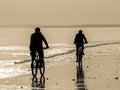 Two Cyclists on the beach