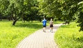 Two cyclists on a forest trail, a man and a woman riding