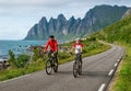 Two cyclists relax biking