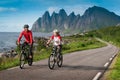 Two cyclists relax biking