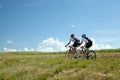 Two Cyclists ride on road in south France Royalty Free Stock Photo