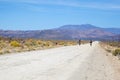 Two cyclists riding on a dirt road in the Karoo