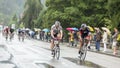 Two Cyclists Riding in the Rain - Tour de France 2014