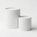 Two cylindrical white cardboard tubes plain eco-friendly packaging containers for product display Royalty Free Stock Photo