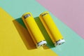 Vibrant Yellow Power Banks on Colorful Geometric Background Royalty Free Stock Photo