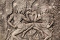 Two dancing women on 12th century relief of the Bayon temple, Cambodia. Historical artwork on wall of Khmer landmark Royalty Free Stock Photo