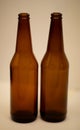 Two dark empty beer bottles. Royalty Free Stock Photo